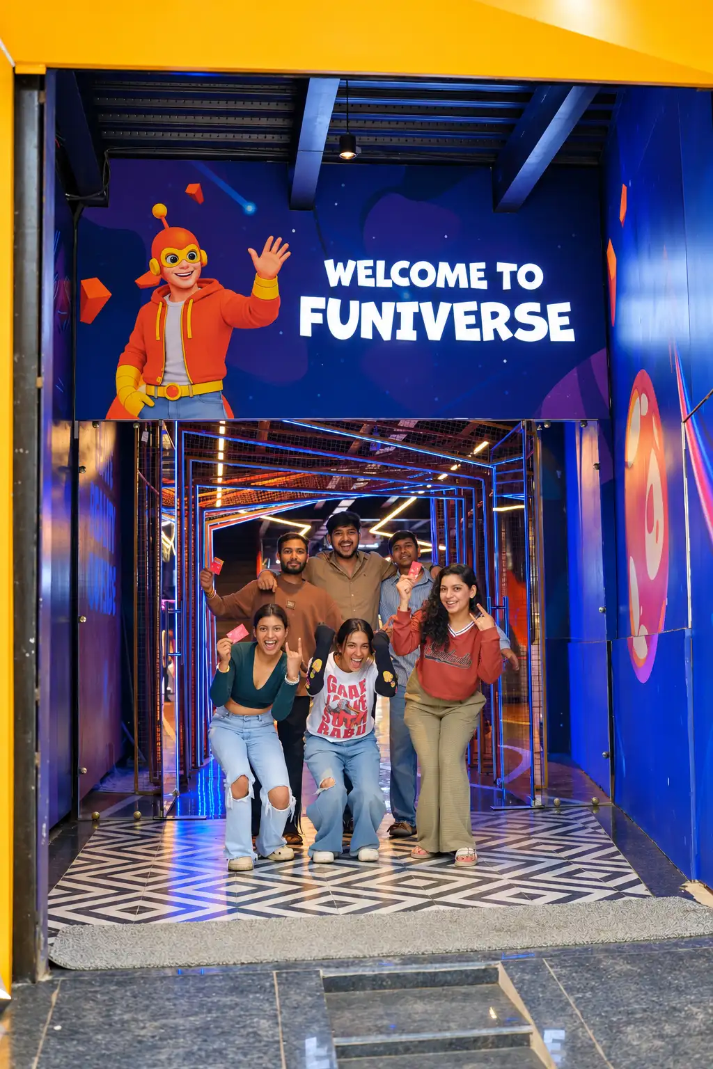 A group of friends laughing together at the Funiverse entrance